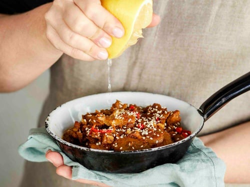 Sticky sauce with fava bean chunks